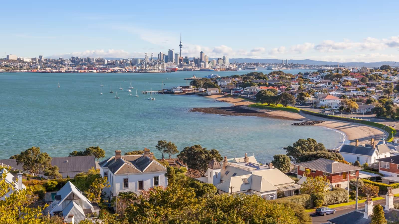 View across Auckland's harbour toward the city skyline and Sky Tower.